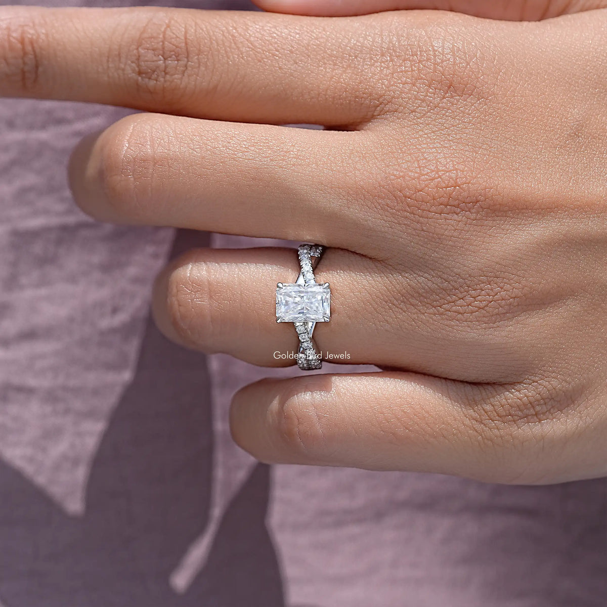 Sterling silver twisted ring with square moissanite center and small side stones