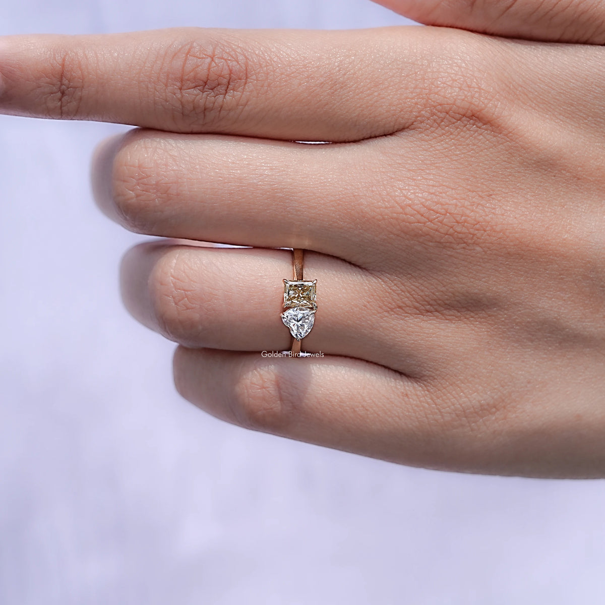 View of Radiant And Heart Moissanite Halo Engagement Ring in prongs setting 
