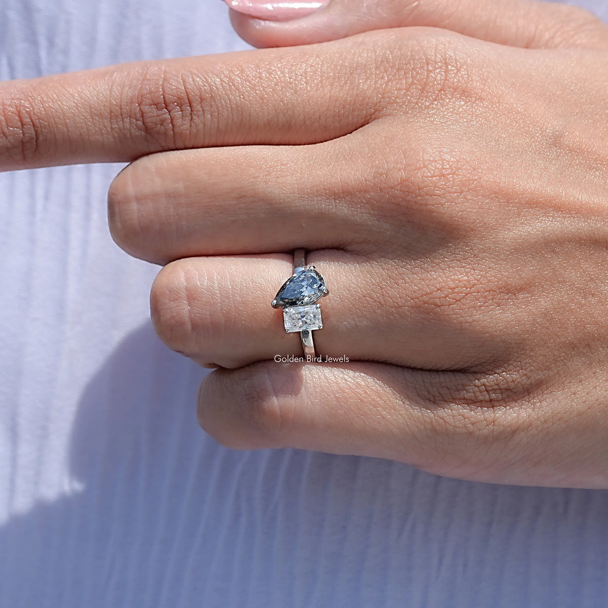 Close View Of Radiant And Pear Cut Moissanite Ring