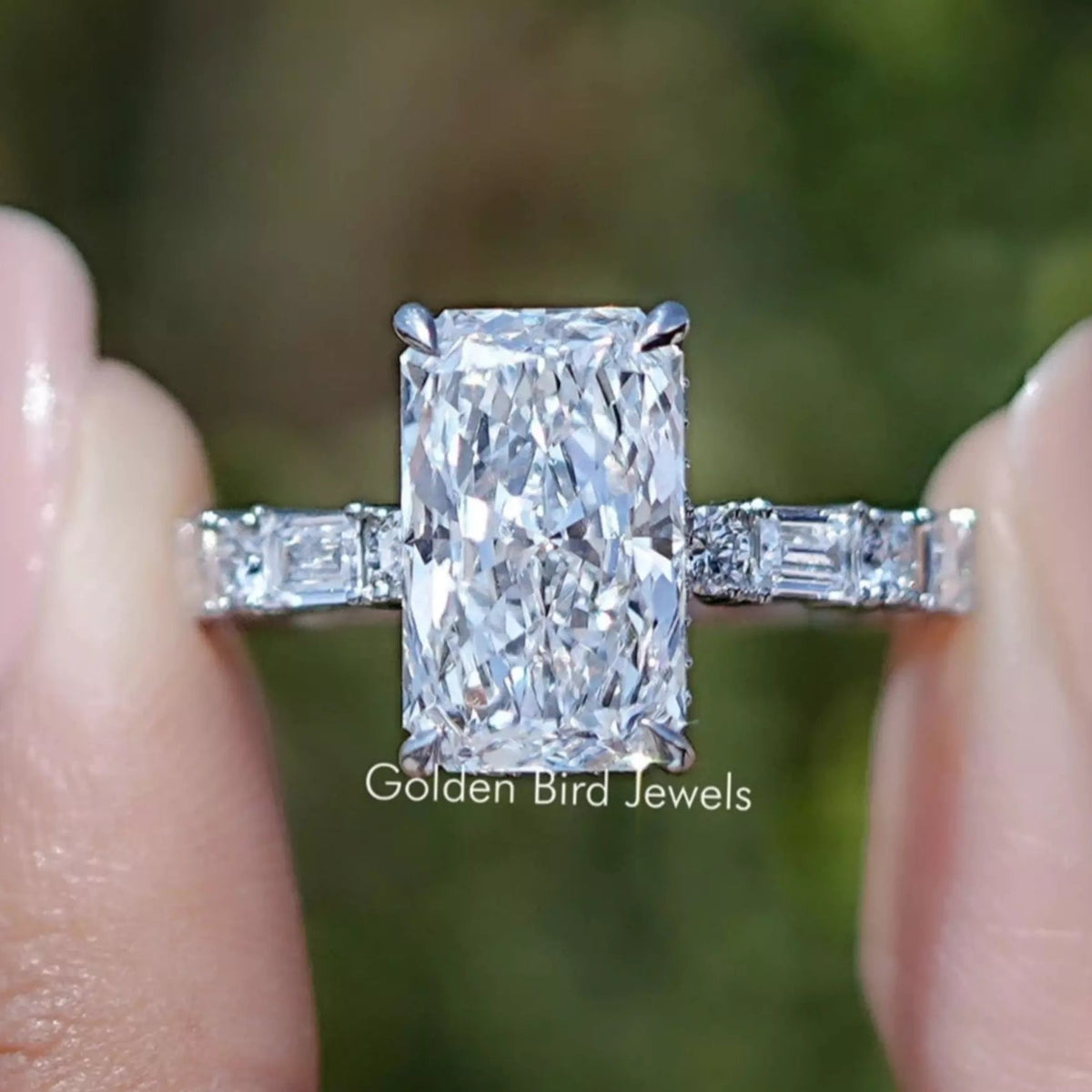 Close-up of radiant-cut center diamond with baguette side stones in ring setting