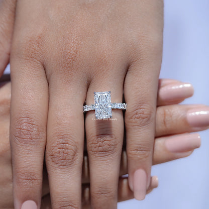 Square radiant-cut lab diamond accent ring with baguette side stones on hand