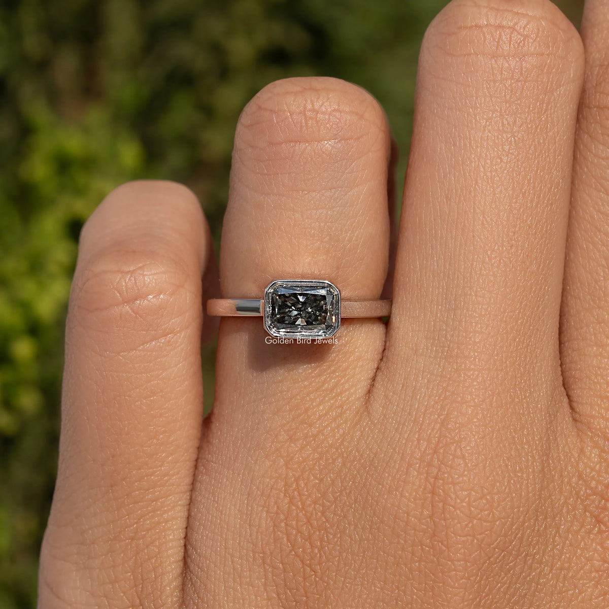 Gray radiant-cut moissanite solitaire ring with square stone in prong setting