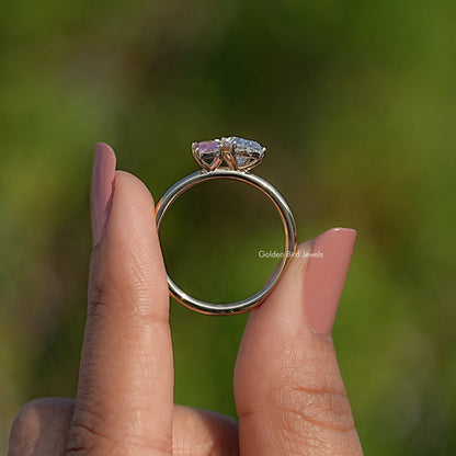 Back view of rose gold-tone two-stone ring with pink gemstone and prong setting