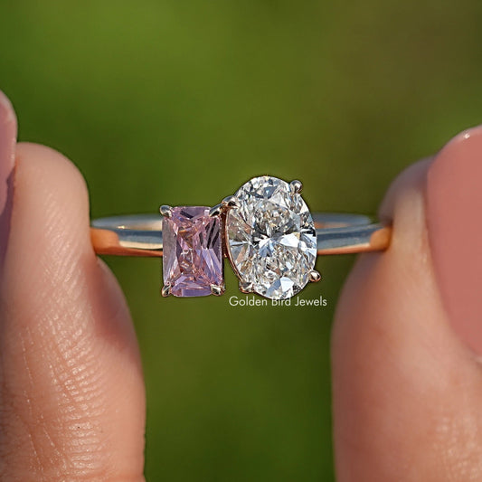 Close-up of rose gold-tone two-stone ring with oval diamond and pink square gem