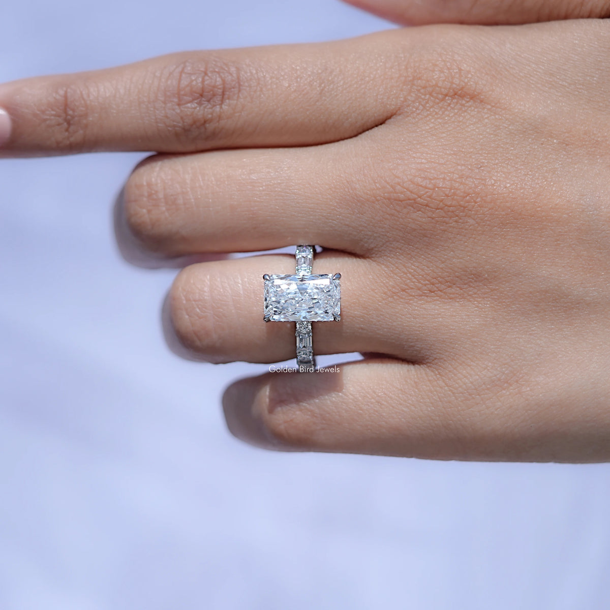 Radiant-cut lab diamond ring with square center stone and baguette side accents