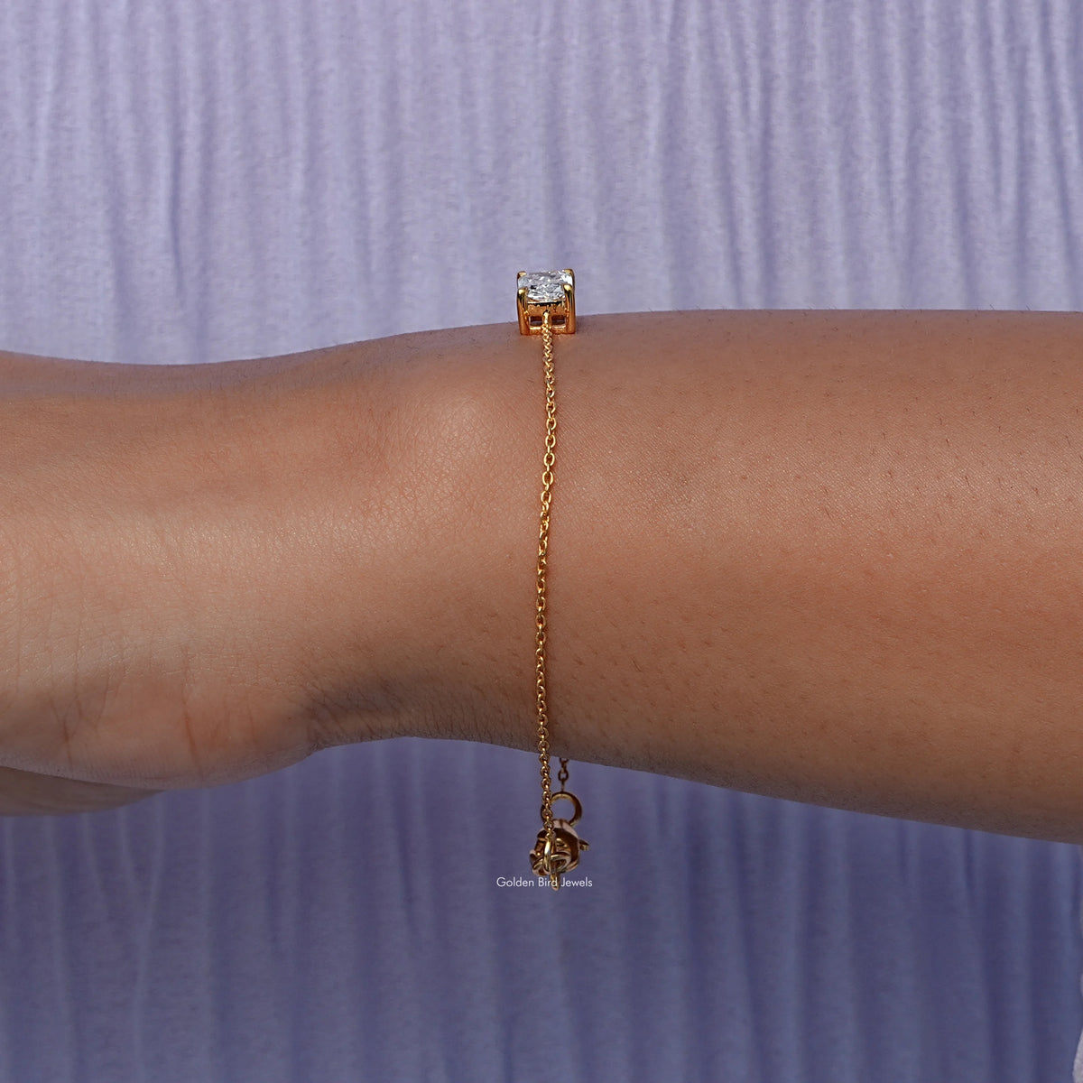 Side view of lab Radiant Cut Bracelet In yellow Gold