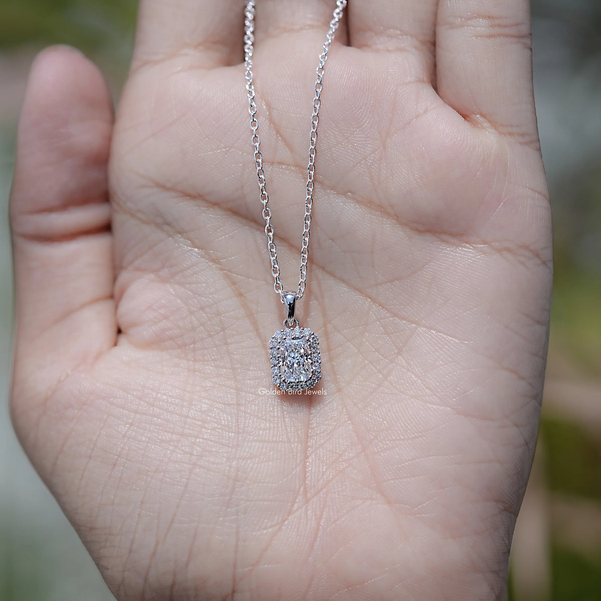 In Hand Showing of Lab Diamond Radiant Cut Halo Necklace