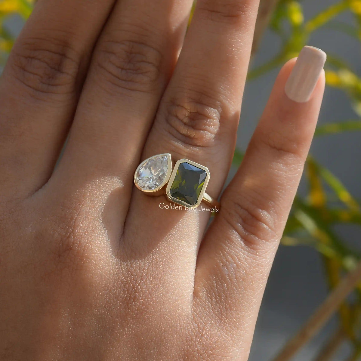 View of Green Radiant And Pear Cut Moissanite Ring In Finger