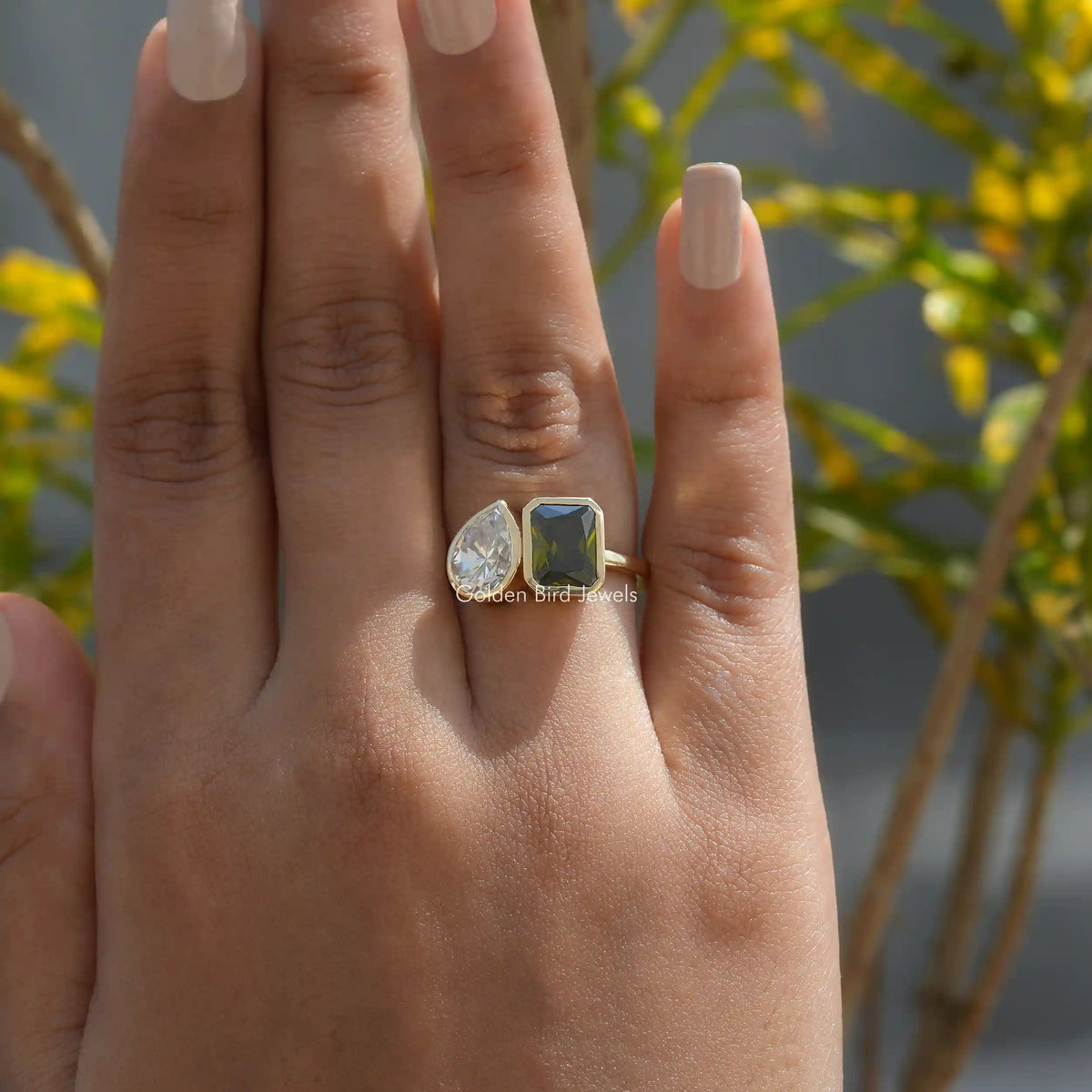View of Toi Et Moi Radiant Cut Moissanite Bezel Set Ring In Finger