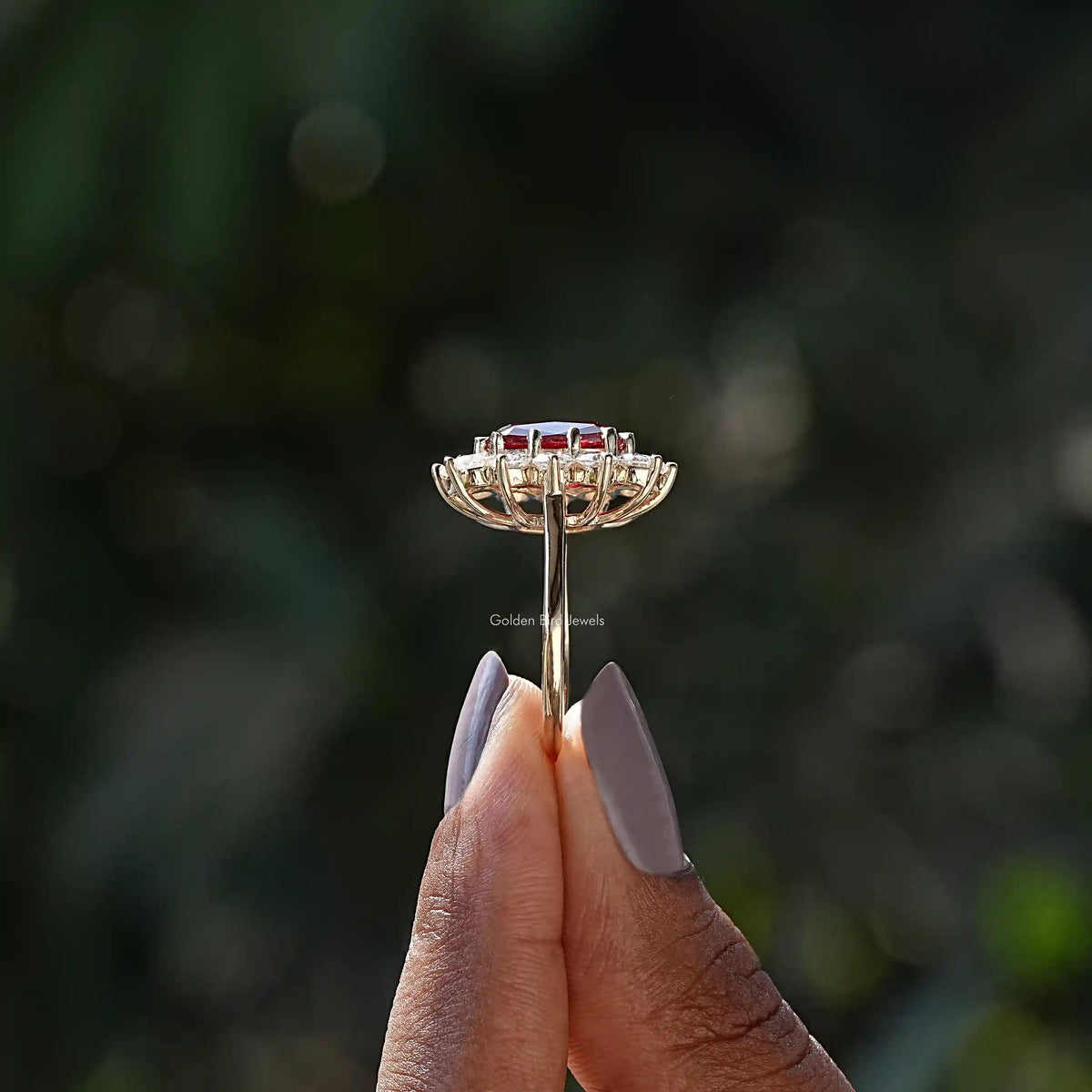 Side View of Cushion Cut And Round Cut Halo Ring In two fingers