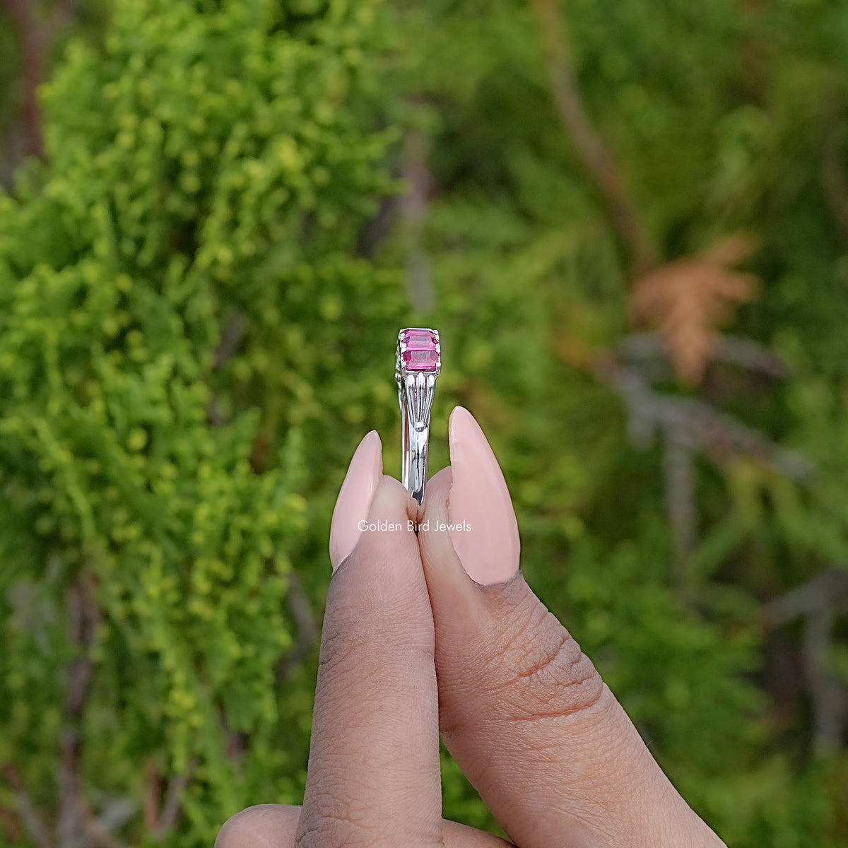 Side View Of Emerald Shaped Gemstone Seven Stone Band
