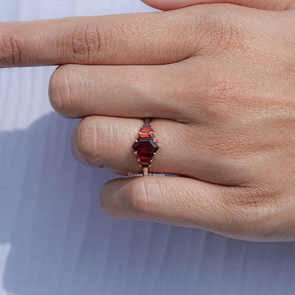 Red hexagon-cut five-stone ring viewed from side, silver-tone band