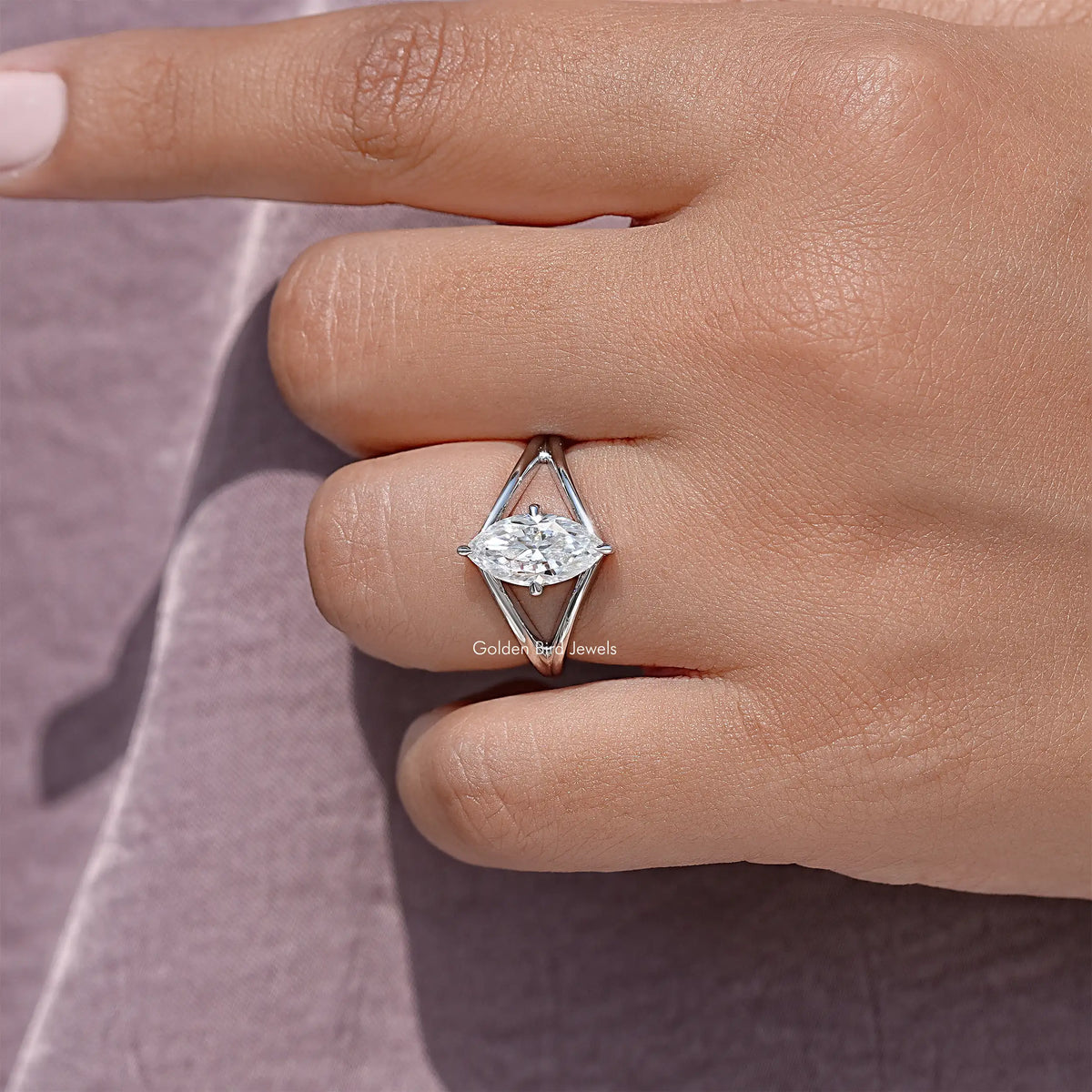 Marquise-cut moissanite solitaire ring with split shank in silver, oval center stone