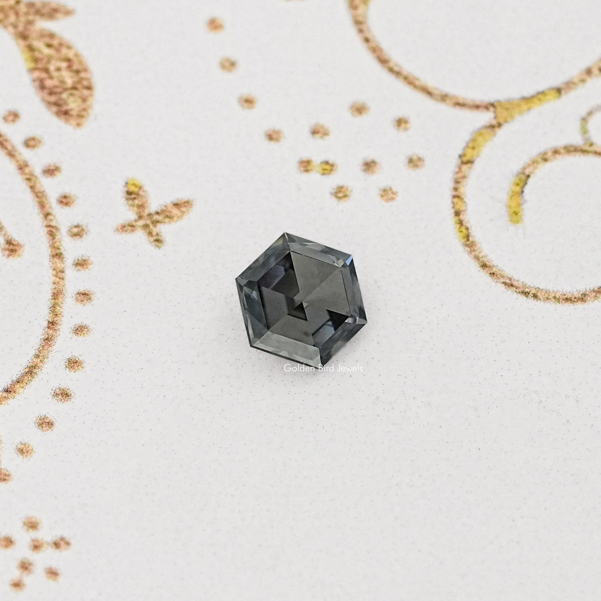 Loose gray hexagon-cut moissanite gemstone, faceted with dark gray facets