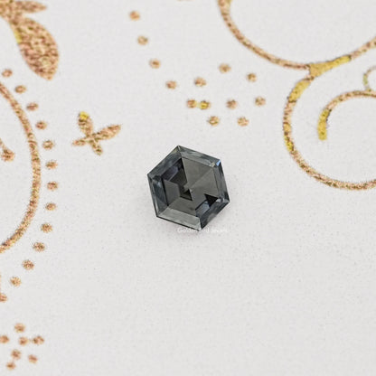 Loose gray hexagon-cut moissanite gemstone, faceted with dark gray facets