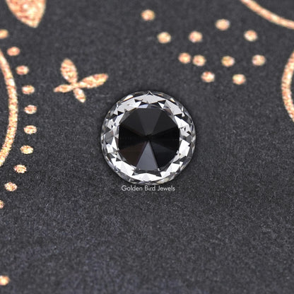 Round rose-cut lab-grown diamond, dark center facets with bright edge reflections