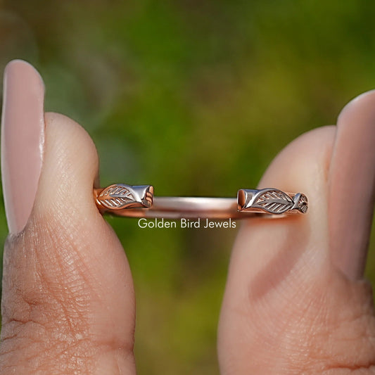Rose-gold tone open cuff wedding band with leaf-style ends on two fingers
