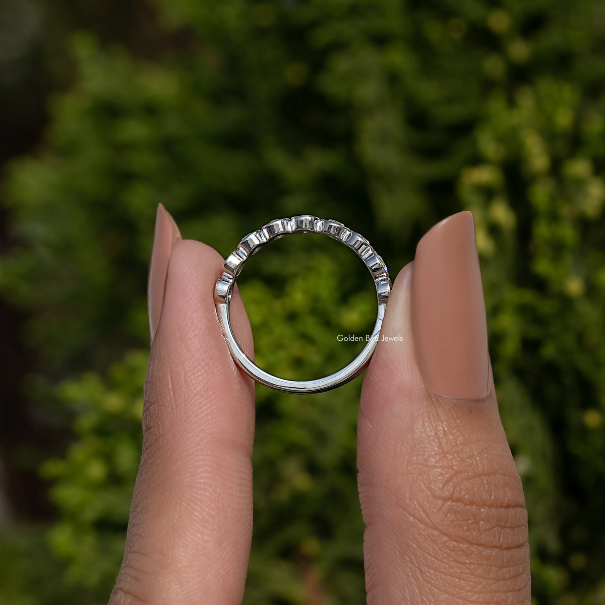 Silver-toned round bezel lab diamond band, open ring view with circular stone row