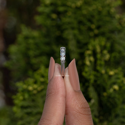 Silver-toned round bezel lab diamond band with stacked round settings, narrow profile