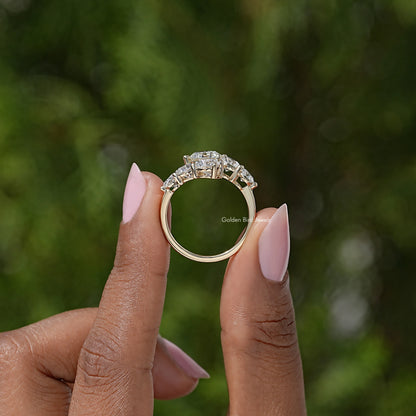 Round moissanite bypass ring, top view showing three stones and open shank