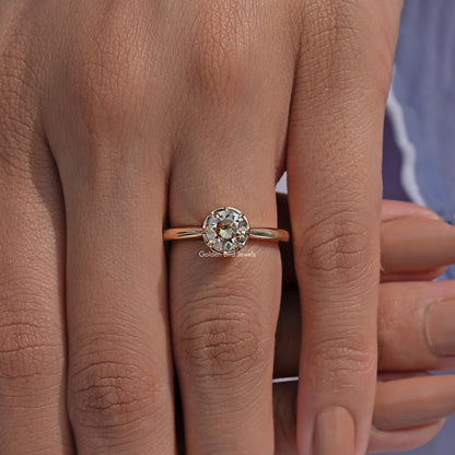 Round moissanite engagement ring with gold-tone band and prong-set round stone