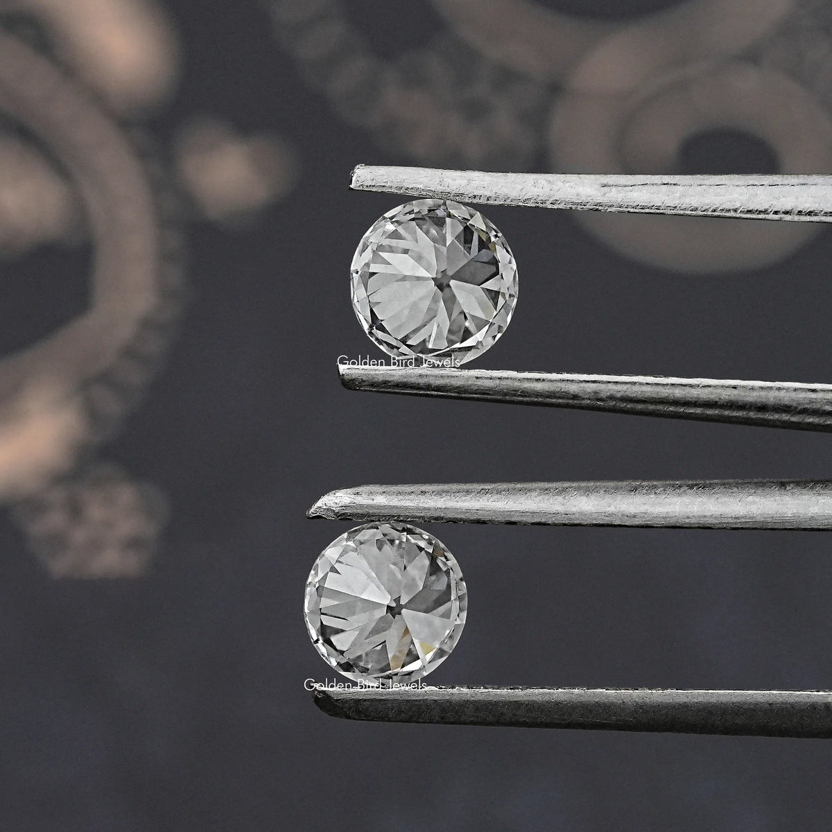 Round old European diamonds in matching stud earrings, prong-set close-up