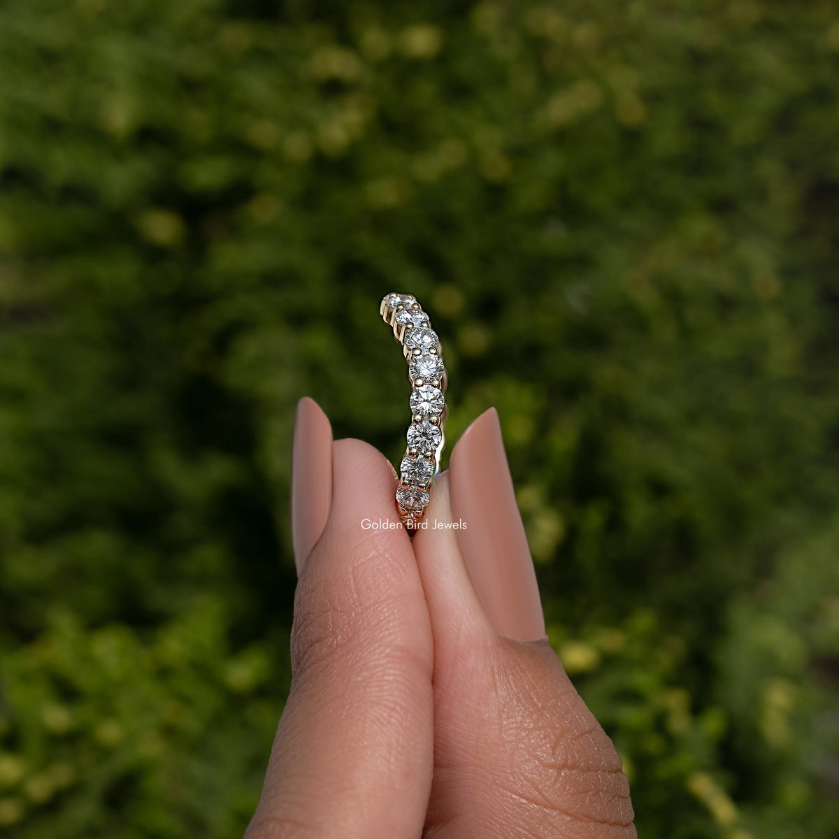 Silver-toned eternity wedding band side view with round-cut lab diamonds