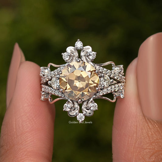 Silver round moissanite ring with wide halo and sculpted vintage setting