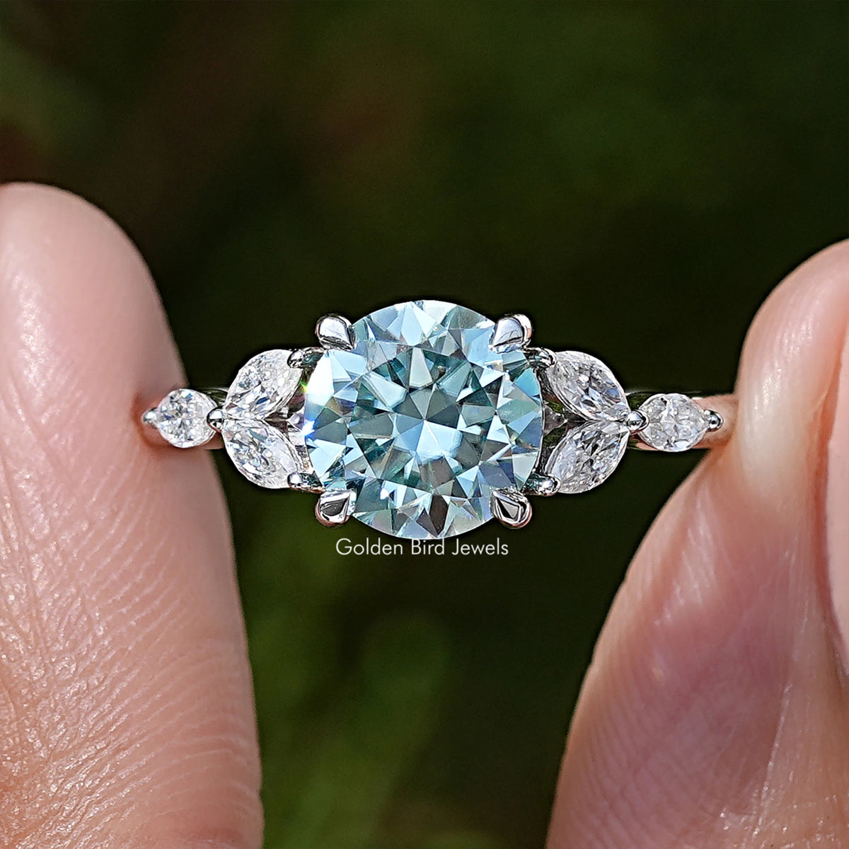 Macro view of sterling silver moissanite engagement ring, large round center stone
