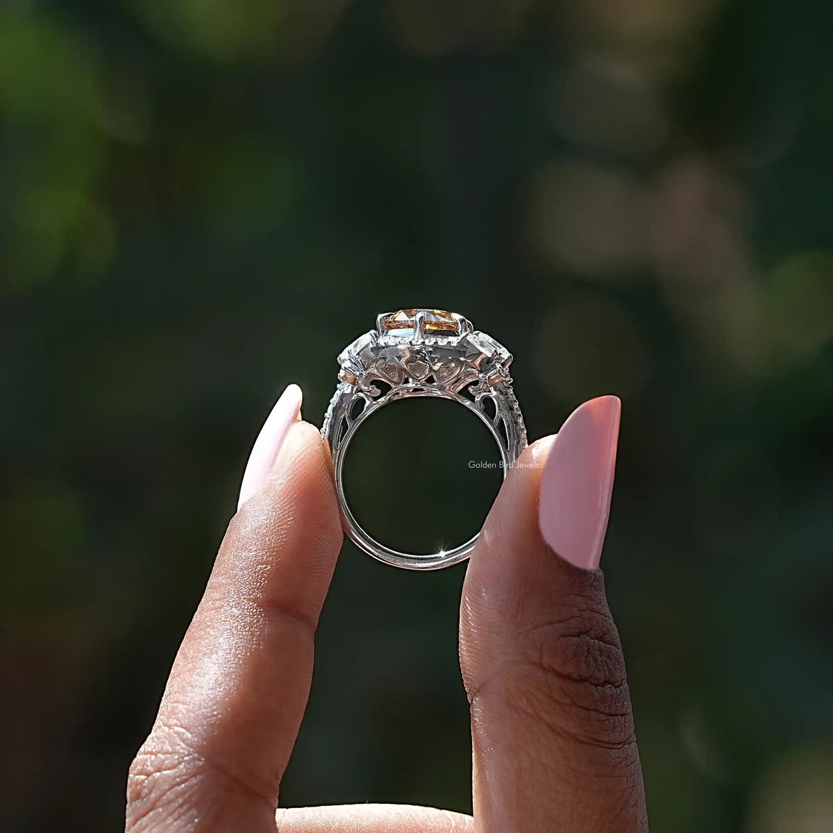 Silver halo cluster ring back view showing open setting and prongs