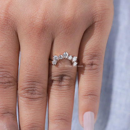 Curved stacking wedding band with five round diamonds across the top