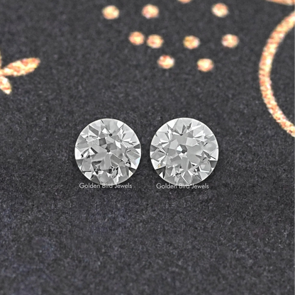 Round old European diamond stud earrings, matching pair with prong-set stones