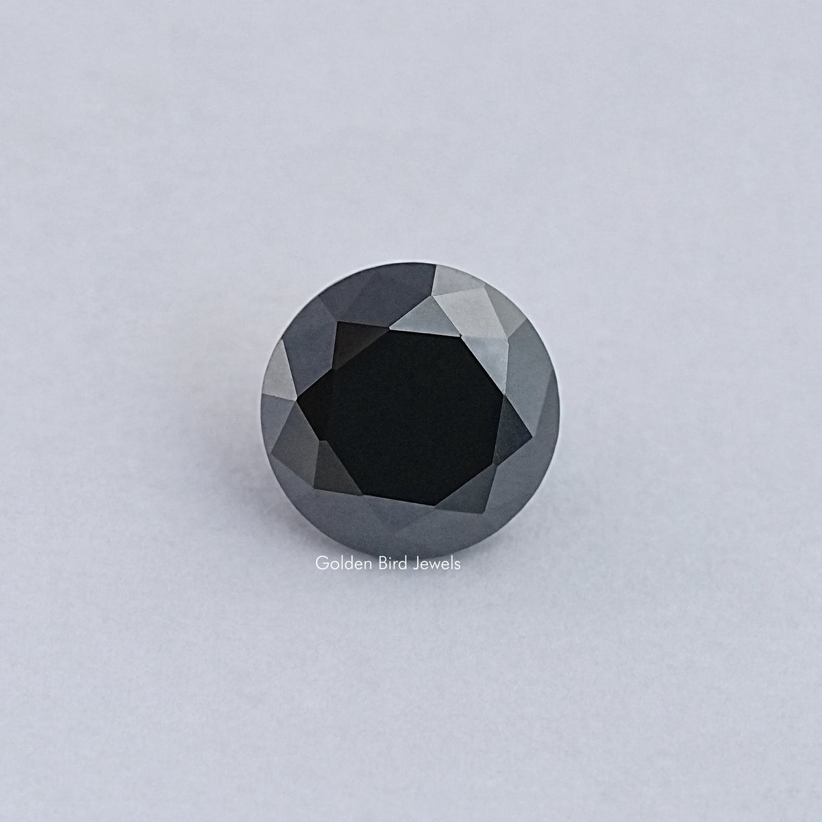 Black round moissanite loose gemstone with faceted surface