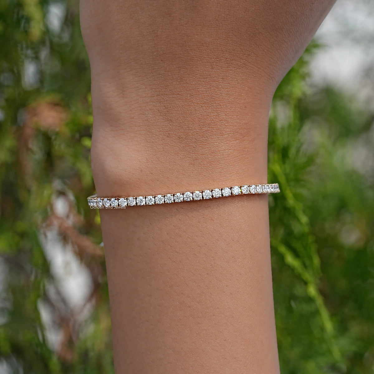 Tennis bracelet with white round stones, slim sparkle band on wrist