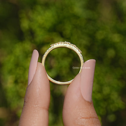 Silver-tone moissanite band ring with round stones across the top, open view