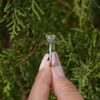 Sterling silver round-cut moissanite solitaire ring with four-prong setting