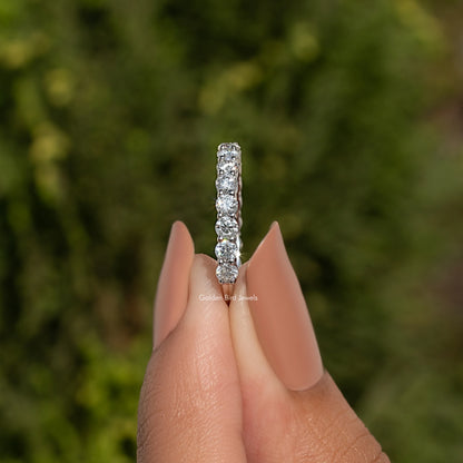 925 sterling silver ring with a straight row of round moissanite stones
