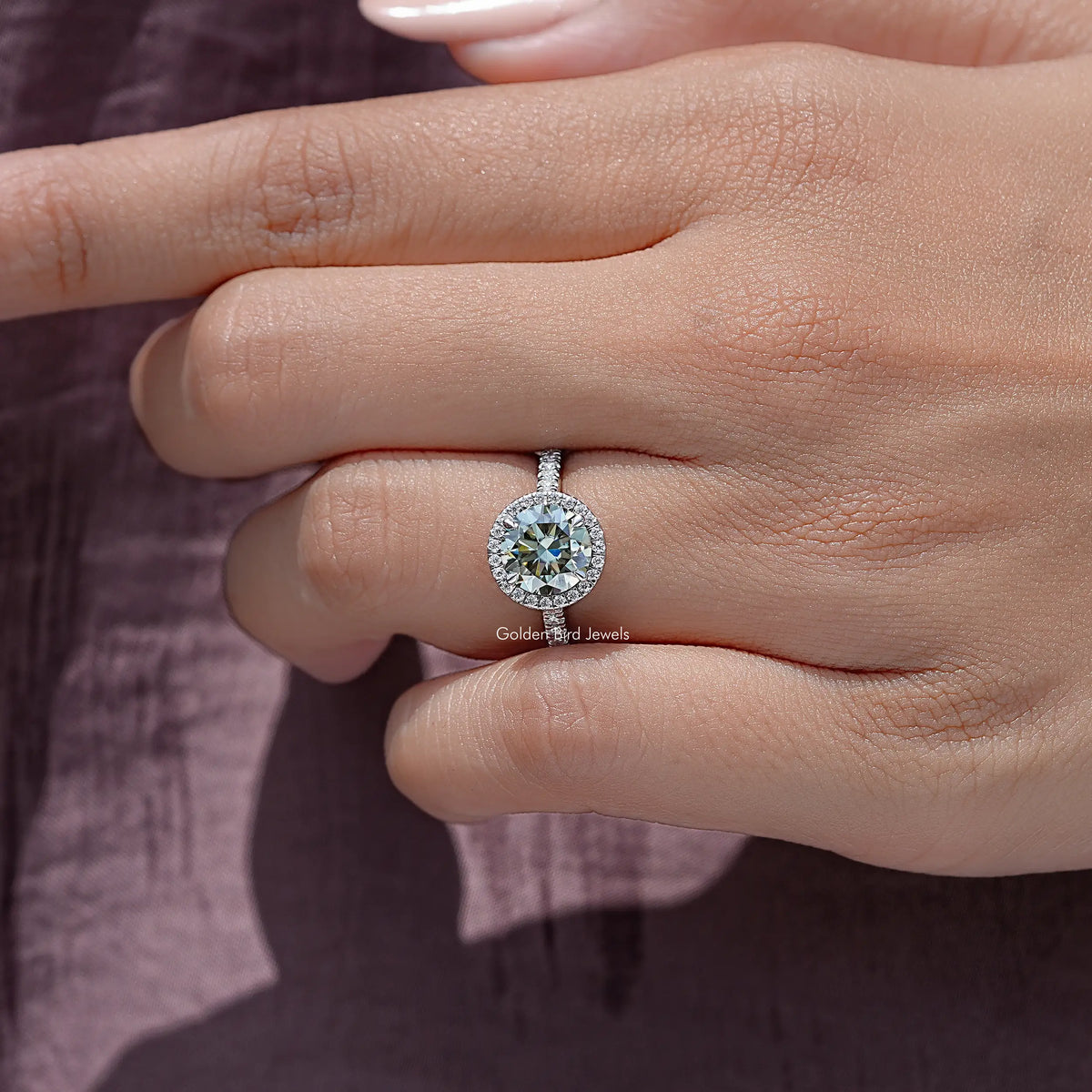 Round cut moissanite accent ring in sterling silver with halo setting