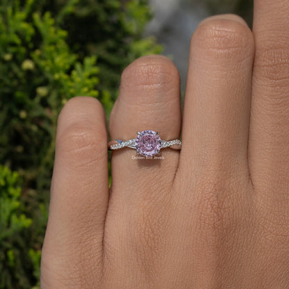 Sterling silver ring with small round pink gemstone and slim band