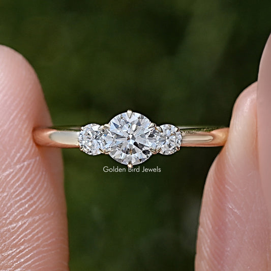 Front view of three-stone round diamond ring with three sparkling prong-set stones