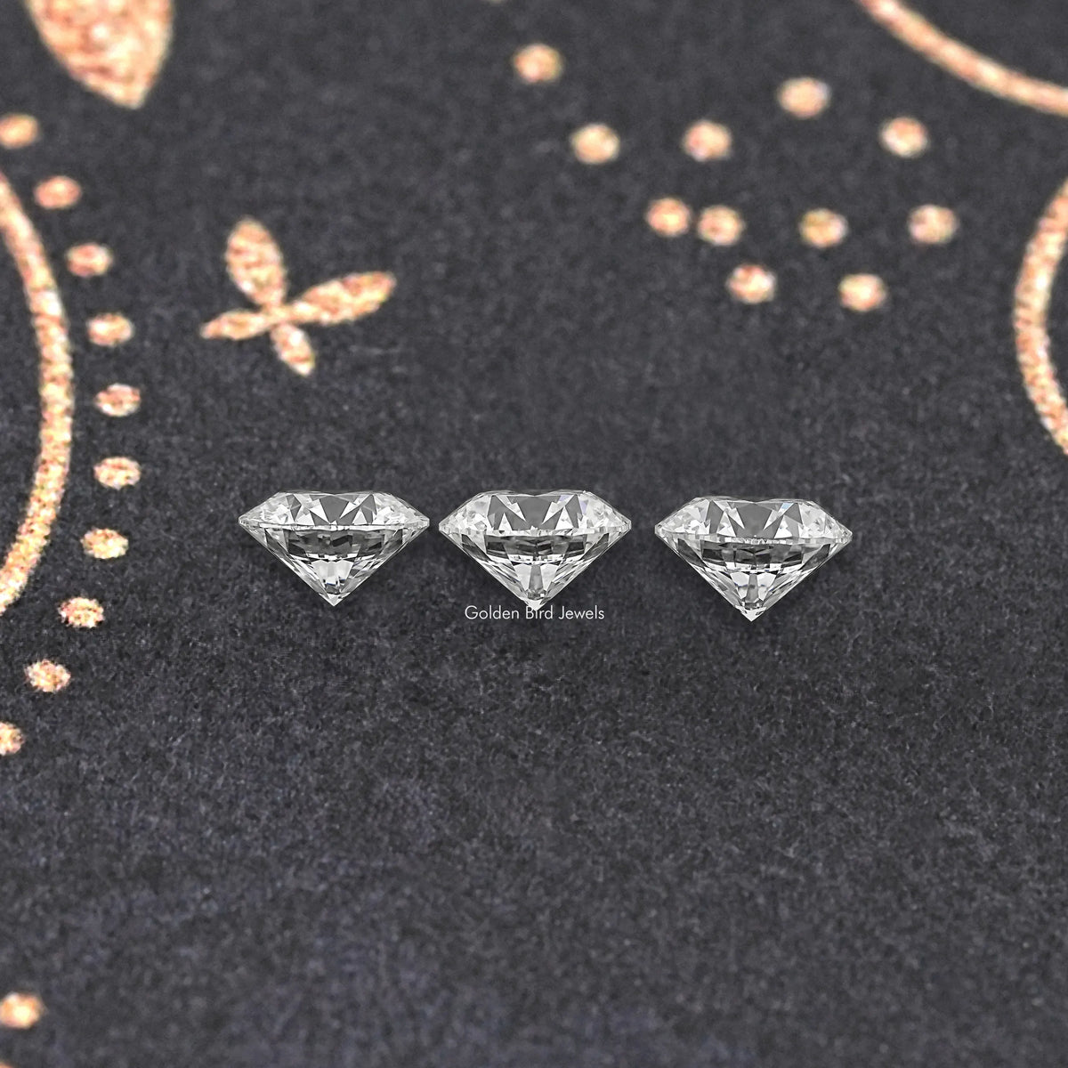 Three round-cut lab-grown diamonds with clear faceted sparkle