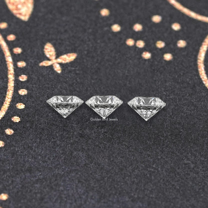 Three round-cut lab-grown diamonds with clear faceted sparkle
