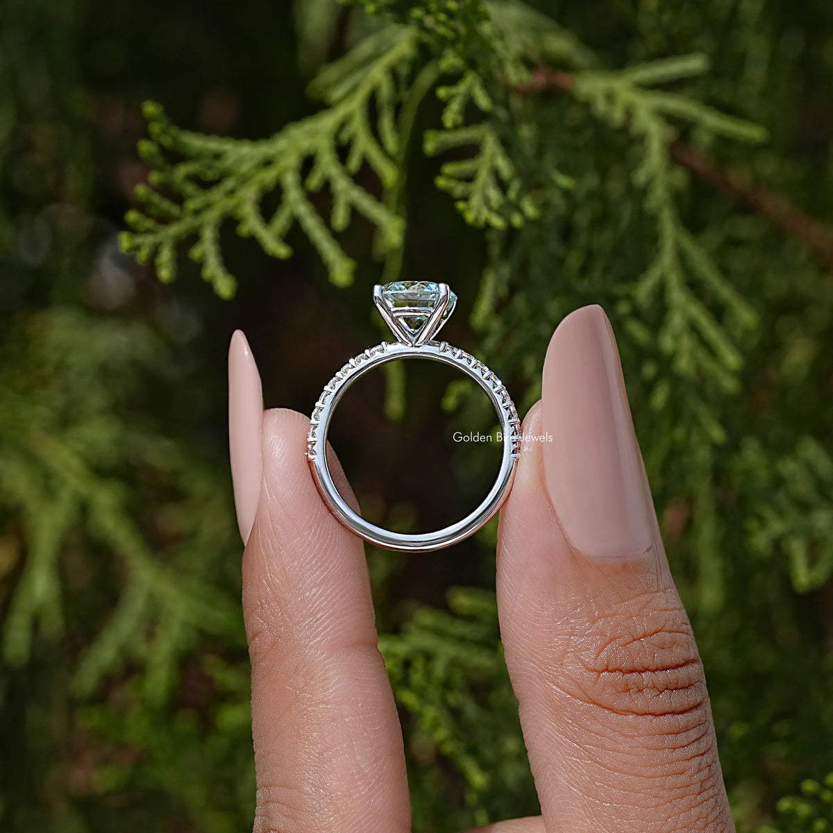 Round cut moissanite solitaire ring in 925 sterling silver, side view