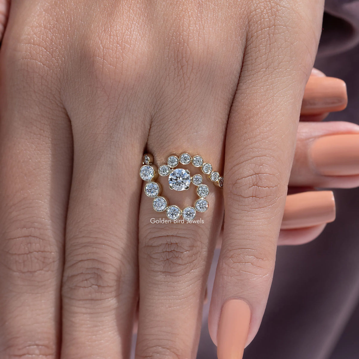 10k yellow gold moissanite engagement ring with round spiral halo stones, close-up