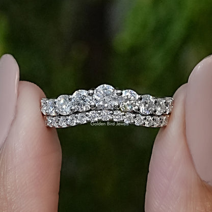 Curved double-row eternity band ring with round clear moissanite-style stones