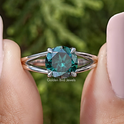 Sterling silver split-shank engagement ring with round teal moissanite center stone