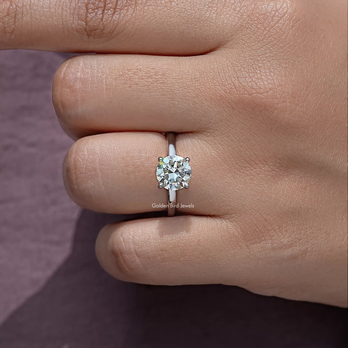 Close-up of round moissanite center stone on sterling silver band