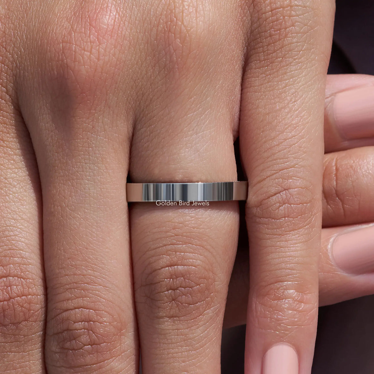 Silver-tone channel-set ring band with round stones, straight-on finger view