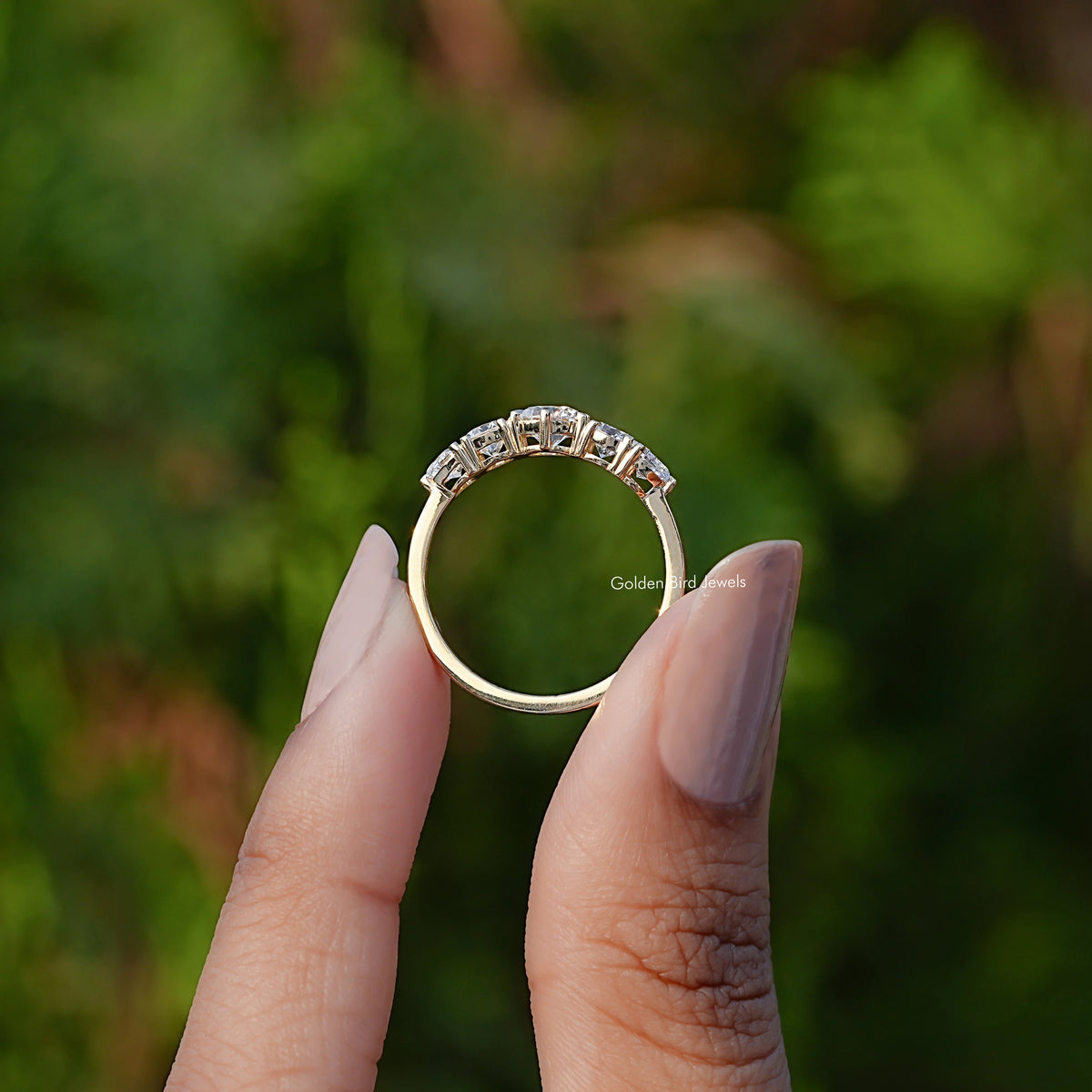 Back View of Round And Heart Lab Grown Diamond Ring In two fingers