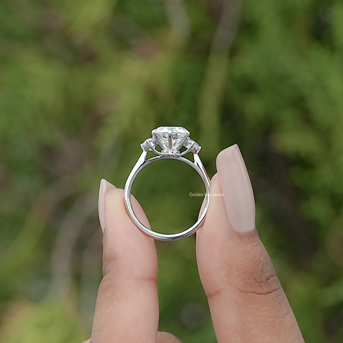 Back view of Old European Oval Moissanite Three Stone Ring in secure setting 